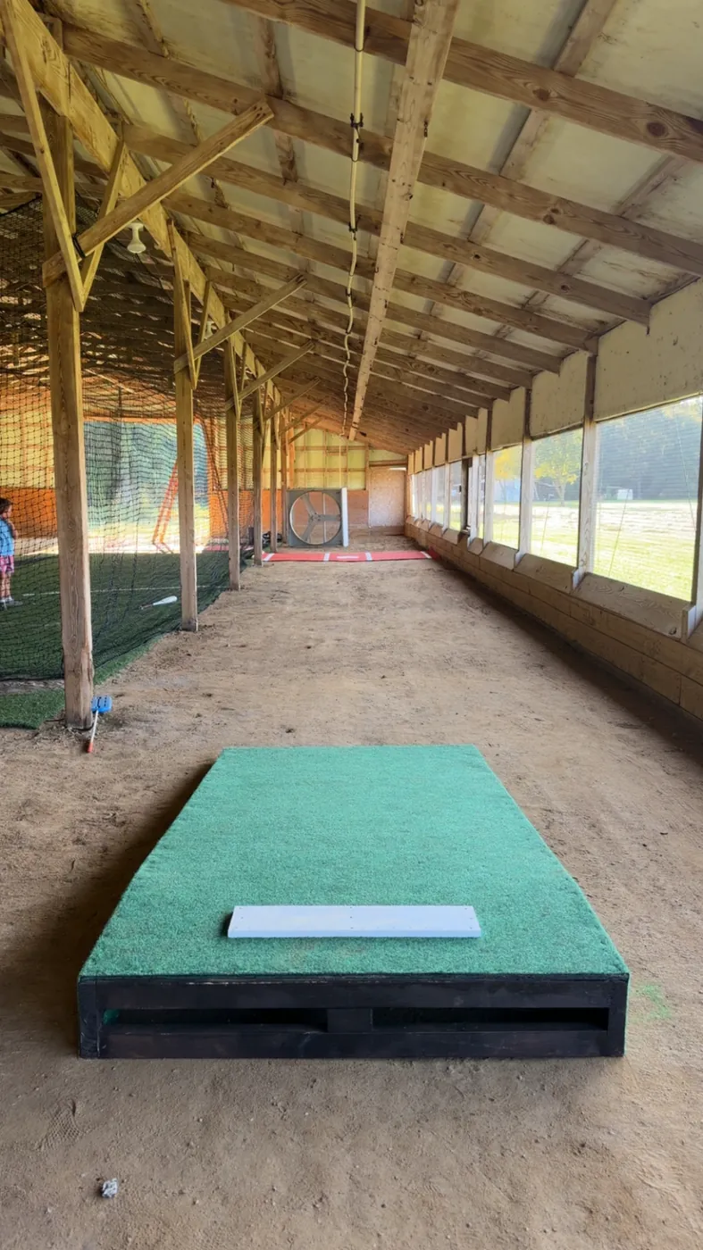 Portable turf pitching mound with rubber in the pitching lane